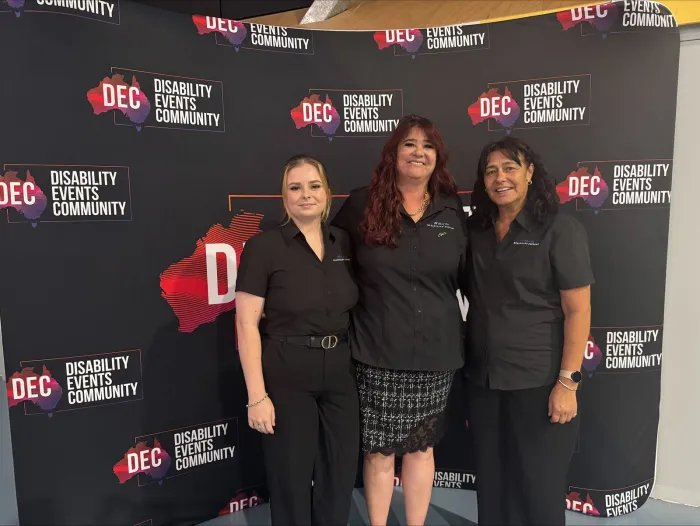 Three AAYDS support workers at a Disability Events Community evening