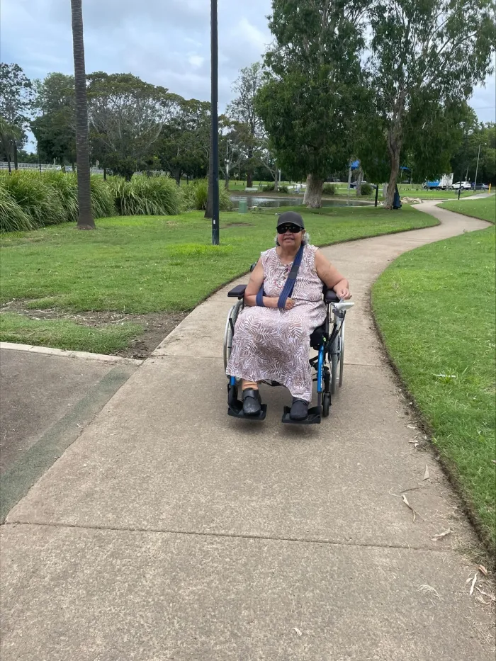 A participant out for a walk along a shaded park path